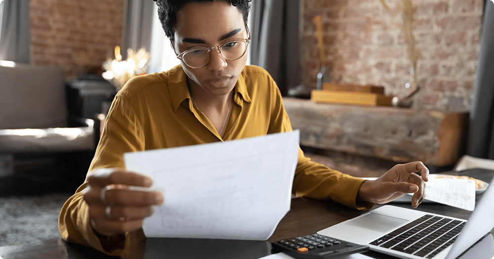 black female landlord reviewing a potential bad renters list.