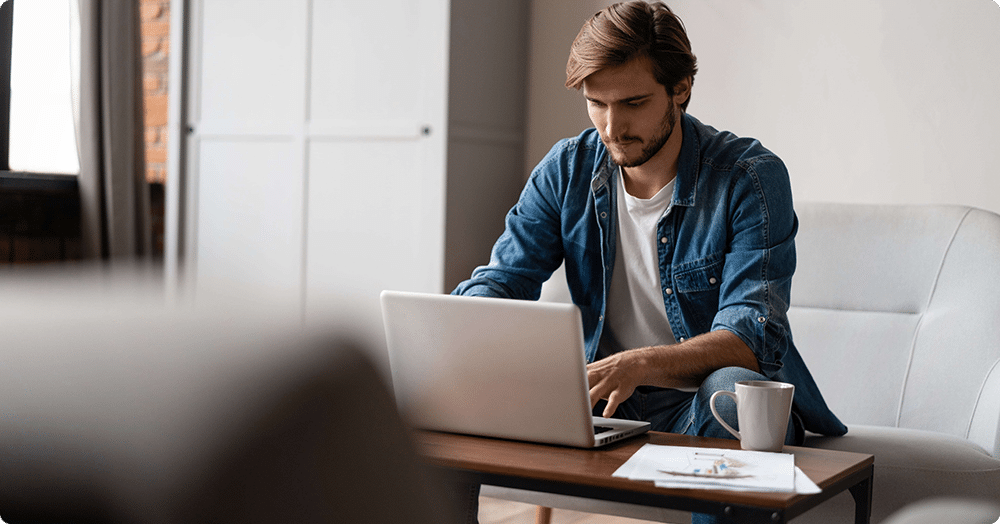 white male landlord working on a share tenant list of positive and negative payments and behaviours